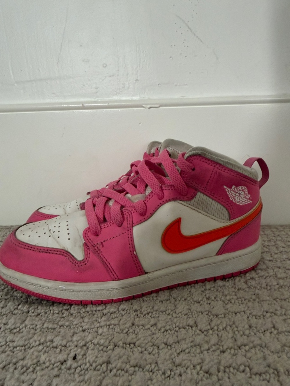 Air Jordan Pink & White Mid-Top Sneakers with Orange Swoosh